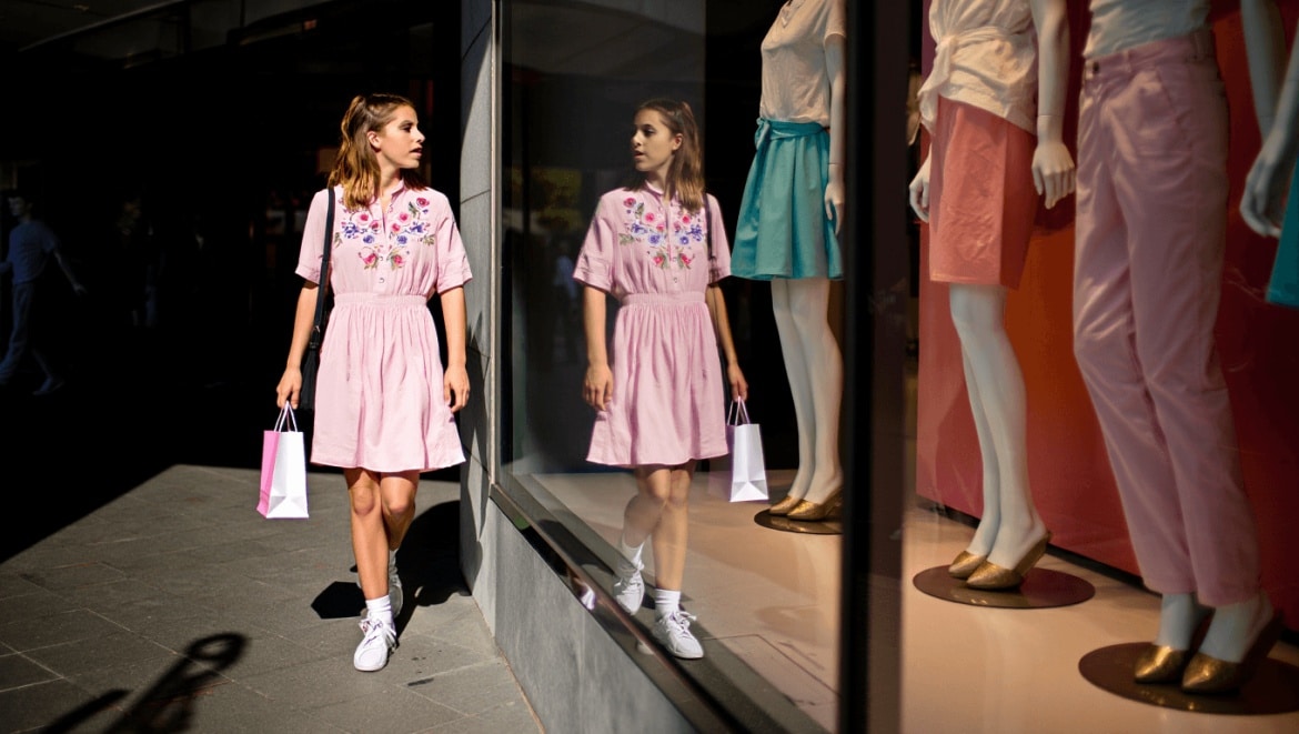 A grid layout showcasing various outfits including jeans dresses and tops modeled by different individuals